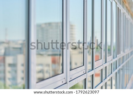 PVC windows on facade of skyscraper. Plastic double glazed windows. Building exterior.