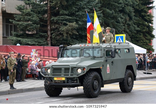 Pyatigorsk, Russia - May 9, 2018: AMZ VPK Tigr is\
a russian multipurpose, all-terrain infantry mobility vehicle. Has\
a National Guard of Russia Emblem. Celebration of the Victory Day\
in Russia