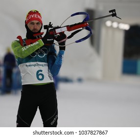 PYEONGCHANG, SOUTH KOREA - FEBRUARY 18, 2018: Jakov Fak Of Slovenia Competes In The Biathlon Men`s 15km Mass Start At The 2018 Winter Olympics In Alpensia Biathlon Centre