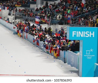 PYEONGCHANG, SOUTH KOREA - FEBRUARY 18, 2018: Biathlon Fans During The Biathlon Men`s 15km Mass Start At The 2018 Winter Olympics In Alpensia Biathlon Centre