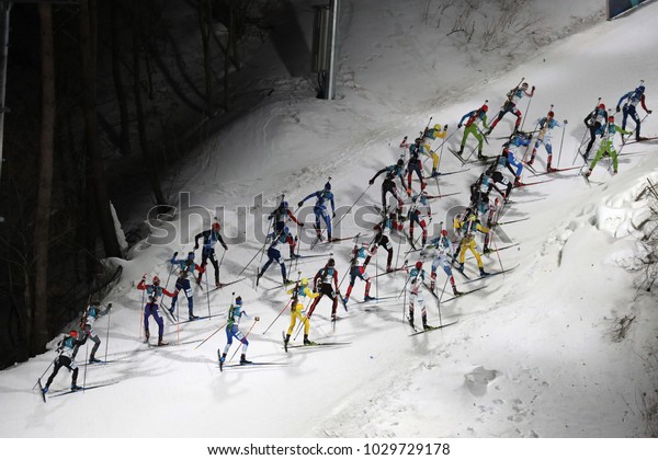 PYEONGCHANG, SOUTH KOREA \
FEBRUARY 18, 2018: 30 best biathlete compete in the biathlon men`s\
15km mass start at the 2018 Winter Olympics in Alpensia Biathlon\
Centre
