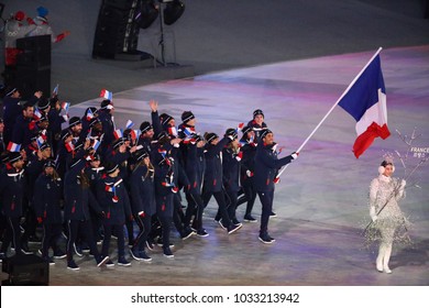 PYEONGCHANG, SOUTH KOREA  FEBRUARY 9, 2018: Olympic Champion Martin Fourcade Carrying The French Flag Leading The Olympic Team France During The PyeongChang 2018 Winter Olympics Opening Ceremony 