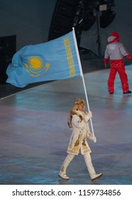 PYEONGCHANG, SOUTH KOREA - FEBRUARY 9, 2018: Abzal Azhgaliyev Carrying The Flag Of Kazakhstan Leading The Olympic Team Kazakhstan At The PyeongChang 2018 Winter Olympics Opening Ceremony