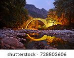 PYLI BRIDGE, TRIKALA, GREECE.
Pyli old stone arched bridge, also know as "Porta Panagia" bridge, close to Pyli town, Trikala, Thessaly, Greece 