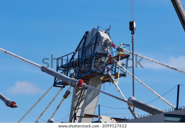 A pylon of a modern cable-stayed bridge with an\
upper holder for cables and platforms. Construction of an\
automobile cable-stayed bridge across the Zeya River.\
Blagoveshchensk, Far East, Russia.\
2021
