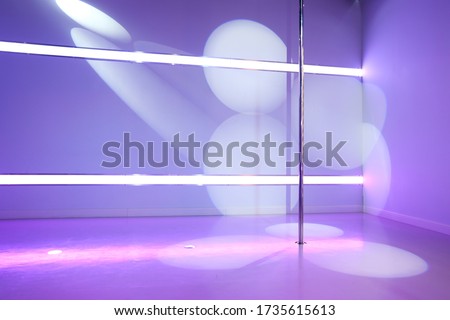 pylon for pole dance exercises in the hall with beautiful lighting