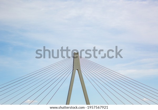Pylon and steel cables of the bridge across the
river rhine close to Neuwied, Germany, with partly cloudy sky -
copy space