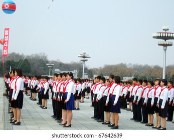 PYONGYANG - MARCH 23: Korean Pioneer Kids During Military Parade On March 23, 2010 In Pyongyang, North Korea