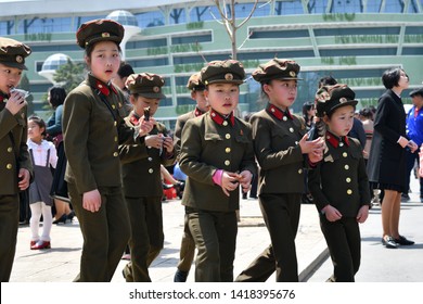 Pyongyang, North Korea - May 1, 2019: Groupof The  Young Girls Dressed In Uniform Of The Korean People Army On The Pyongyang Street