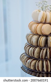 Pyramid of caramel and chocolate macarons at a wedding candy bar