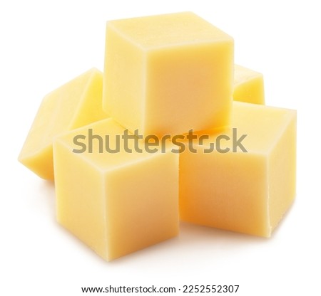 Pyramid of cheese cubes isolated on white background. Clipping path.