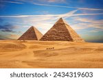 The Pyramid of Chephren and the Pyramid of Cheops in the sands of Giza desert, Egypt