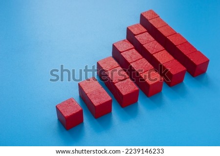A Pyramid from red cubes. Scalability concept.