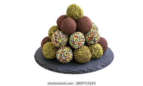 Pyramid stack of assorted chocolate truffles with pistachio and colorful sprinkles