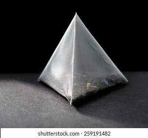 Pyramid Tea Bag On Black Background