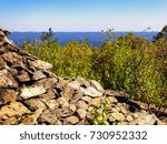 A pyramidal stone tower was built on the peak in 1885. The current plaque which was originally on the now-demolished pyramid erroneously calls the peak the highest ground in Connecticut United States.