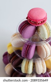 Pyramide of French colorful  macarons with chocolate and fruit filling, view from top