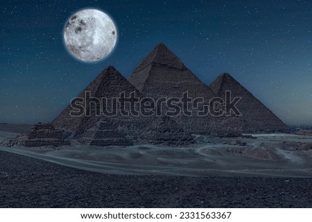 The Pyramids of Giza by night in Egypt 