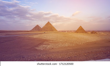 Pyramids of Giza with city view background