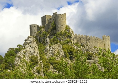 The Pyrenees Mountains and the Château de Pureilauns (Puilaurens Castle, also Puylaurens) is one of the so-called Cathar castles in the commune of Lapradelle-Puilaurens in the Aude département, France