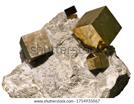 Pyrite cubic crystals embedded in a matrix on white background