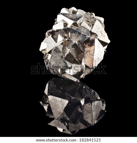 Pyrite with reflection on black surface background 