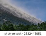 Pyroclastic flows seen sliding down  Merapi volcano. eruption observed from Babadan Observation Post