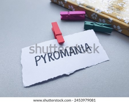 Pyromania writting on table background.