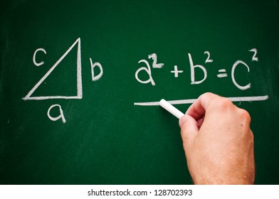 Pythagorean theorem sketched with white chalk on a chalk board - Powered by Shutterstock