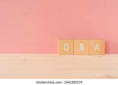 Q and A; Three wooden blocks with 