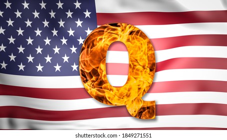Q Anon conspiracy theory. Mystical Q letter on fire with USA flag on the background