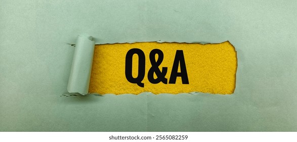 Q and A (question and answer) Concept - Text displayed on a yellow torn background.
