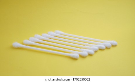 Q Tip Ear Isolation Yellow Background 