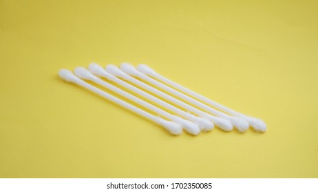 Q Tip Ear Isolation Yellow Background 