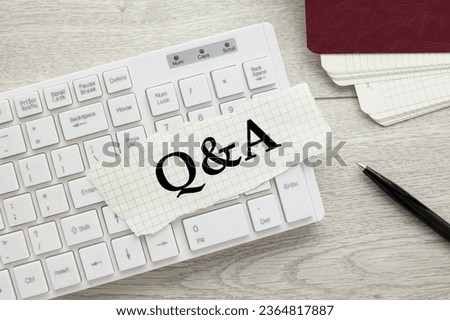 Q and A white keyboard on the desktop.torn paper text Stock foto © 