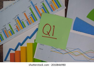 Q1 - 1st Quarter Period Write On Sticky Notes Isolated On Wooden Table. Stock Market Concept