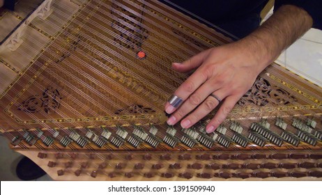 Qanun Player Closeup Photo.