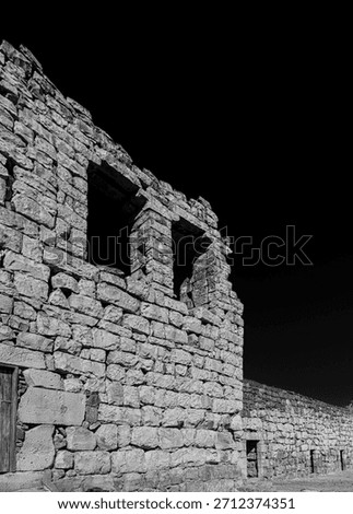 Qasr al-Azraq (Azraq Castle): Historic black basalt Roman Ayyubid fortress in Jordan's desert. Famous T.E. Lawrence Arab Revolt HQ.
