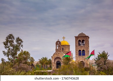 Qasr El-Yahud Is The Site Of The Baptism Of Jesus Christ By John The Baptist. Church Of John The Baptist. Jordanian National Flags Fluttering On Jordanian Side. The Concept Of Religious Tourism