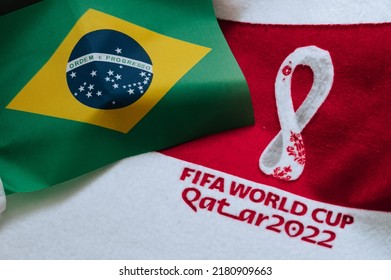 QATAR, DOHA, 18 JULY, 2022: Brazil National Flag And Logo Of FIFA World Cup In Qatar 2022 On Red Carpet. Soccer Sport Background, Edit Space. Qatar 22 Wallpaper. National Symbol, Football Event