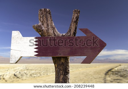 Qatar wooden sign isolated on desert background