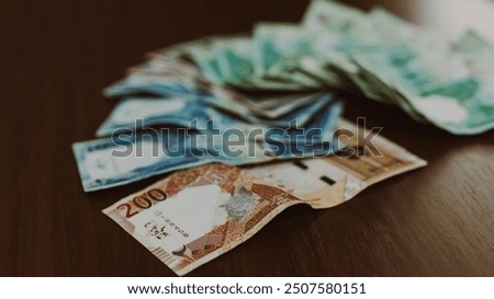 Qatari one riyal banknote closeup macro fragment, Qatar money close up. High quality photo