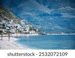 Qeparo Beach is located in front of the township in the heart of the Albanian Riviera. The beach is nicely located on a large west facing bay which makes for great sunset views.