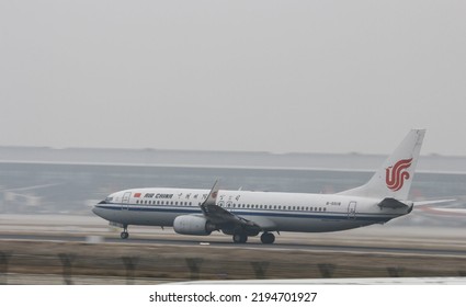 Qingdao, China- August 18,2022: A White Air China Passenger Plane Is Parked On The Runway