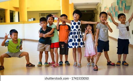 Qingyuan, China - July 22, 2016: a group of children in Asian private kindergarten, activities for child's development, happy childhood, preschool education,