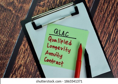 QLAC - Qualified Longevity Annuity Contract Write On Sticky Notes Isolated On Wooden Table.