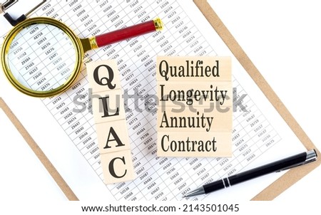QLAC Qualified Longevity Annuity Contract text on wooden block on a chart background