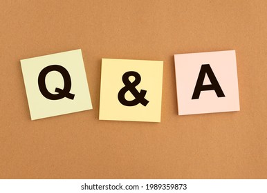 Qna inscription on papers. QA acronym. Q concept. Questions and answers abbreviation.