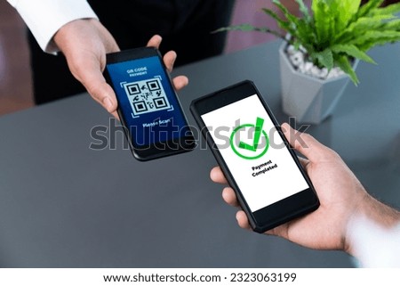 QR code displayed on screen for cashless payment scanning. Closeup hands hold smartphone to transfer money by electronic transaction from mobile app. Bar code technology for fast payment. Fervent