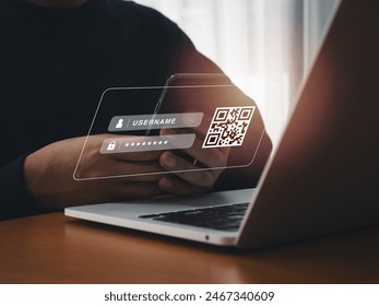 QR Code, multi factor authentication security concept. Digital QR code scanning for login on website screen from laptop computer, scanning by mobile phone camera lens holding by businessman hand. - Powered by Shutterstock - Get 15% off with code: PIKWIZARD15